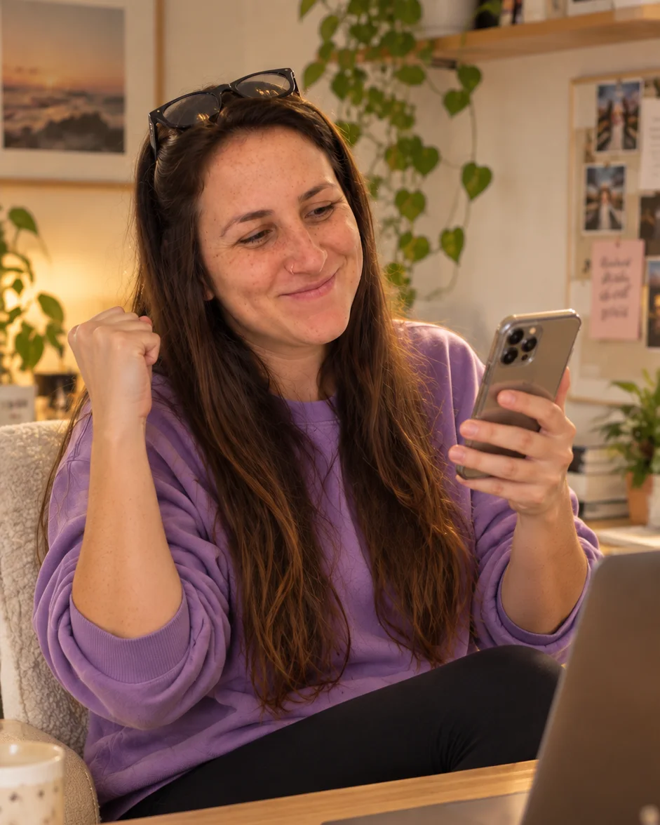 Ela Keren at her desk, celebrating